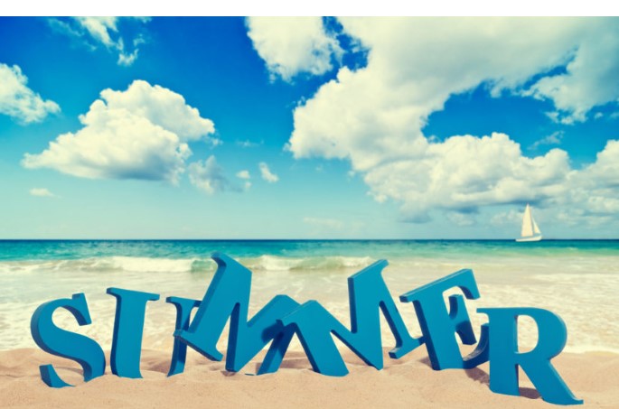 Summer word on beach with blue sky and clouds. 10 expert tips for a happy and healthy summer season